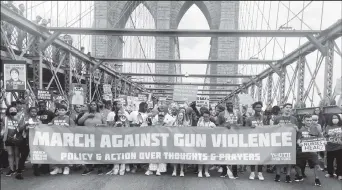  ?? ?? People cross the Brooklyn Bridge as they attend “March for Our Lives” rally, one of a series of nationwide protests against gun violence, New York City, U.S., June 11, 2022. (REUTERS/Eric Cox photo)