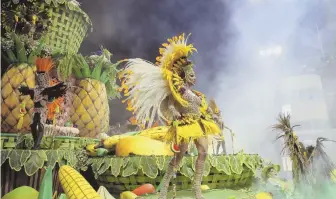  ?? AP PHOTO ?? SHOW TIME: Dancers from the Rosas de Ouro Samba school perform on a float during a Carnival parade in Sao Paulo, Brazil, yesterday.