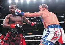  ?? AFP ?? Logan Paul lands a punch on KSI in the rematch that the Brit won in a tight bout at the Staples Centre in Los Angeles