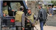  ?? Reuters ?? VIGIL: Riot police officers stand guard in the Cairo suburb of Maadi, Egypt, on Friday. Four soldiers were killed in an explosion that hit their armoured vehicle on Saturday in Sinai.-