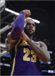  ?? MARK J. TERRILL - THE ASSOCIATED PRESS ?? Los Angeles Lakers forward LeBron James gestures after scoring during the second half of the team’s NBA basketball game against the Denver Nuggets on Wednesday, March 6, 2019, in Los Angeles. The Nuggets won 115-99.