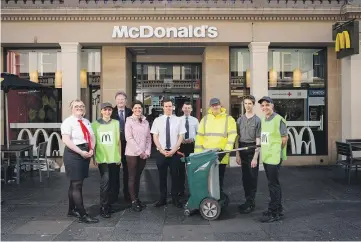  ?? ?? Above and top: McDonald’s team outside their restaurant on Reform Street last month with sports broadcaste­r Eilidh Barbour and Dundee franchisee Nick McPartland. The initiative has seen a positive impact on reducing litter.