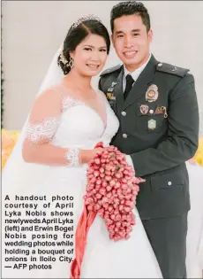  ?? — AFP photos ?? A handout photo courtesy of April Lyka Nobis shows newlyweds April Lyka (left) and Erwin Bogel Nobis posing for wedding photos while holding a bouquet of onions in Iloilo City.