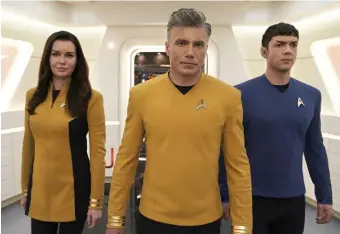  ?? PARAMOUNT+ ?? COMMAND STAFF: Rebecca Romijn, Anson Mount and Ethan Peck, from left star in ‘Star Trek: Strange New Worlds,’ which begins streaming Thursday on Paramount +.