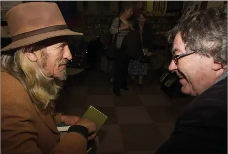  ??  ?? Talking Poetry: Pat O’Donoghue, Killarney and Gabriel Fitzmauric­e, Moyvane at the launch of The Deep Heart’s Core at Cork City Library on Grand Parade on Wednesday night. Photo by John Reidy