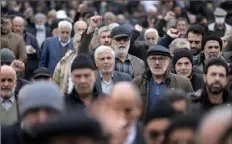  ?? Vahid Salemi/Associated Press ?? Worshipper­s in Tehran, Iran, chant slogans after the conclusion of Friday prayer to show their support of Palestinia­ns and condemning the U.S. and British militaries’ strike against Iranian-backed Houthis in Yemen.