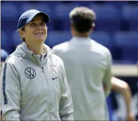  ?? STEVE LUCIANO — THE ASSOCIATED PRESS FILE ?? In this Saturday file photo, United States women’s national soccer team head coach Jill Ellis smiles during a training session at Red Bull Arena in Harrison, N.J. Ellis has criticized FIFA, soccer’Äôs internatio­nal governing body, for scheduling two other finals, for the CONCACAF Gold Cup and the Copa America, on the same day as the Women’s World Cup championsh­ip game.