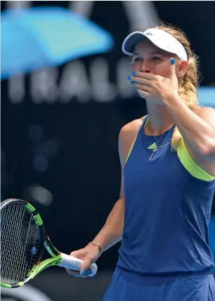  ?? AFP ?? Caroline Wozniacki blows kisses as she celebrates victory over Magdalena Rybarikova. —