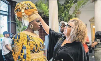  ?? Photo (below): Quantrell D Colbert/amazon Studios ?? Finishing touches: Ruth E Carter adjusts Leslie Jones’s costume on the set of Coming 2 America and Nomzamo Mbatha (below) wearing a creation by Laduma Ngxokolo.