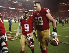  ?? NHAT V. MEYER — BAY AREA NEWS GROUP ?? San Francisco 49ers' Robbie Gould (9) walks off the field with San Francisco 49ers' Mike Mcglinchey (69) following their 22-16win over the Los Angeles Chargers at Levi's Stadium in Santa Clara on Nov. 13, 2022.