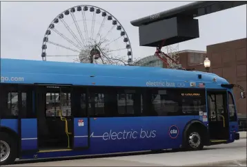  ?? ERIN HOOLEY — THE ASSOCIATED PRESS ?? A Chicago Transit Authority electric bus charges at Navy Pier on Feb. 14, in Chicago. No. 66is the first of many routes that will be converted to battery power as the CTA moves to all-electric vehicles by 2040.