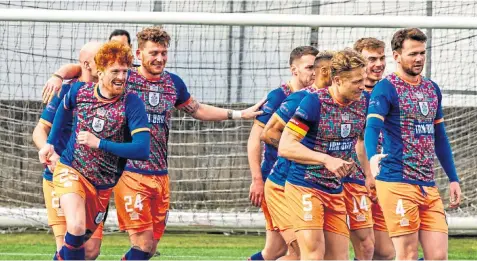  ??  ?? Simon Murray (left) cannot take the smile off his face after opening the scoring for Queens Park at Ochilview