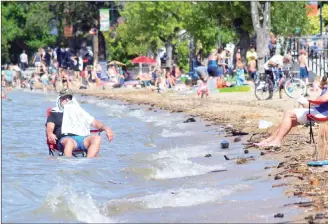  ?? JOE FRIES/Penticton Herald ?? Beach space on Okanagan Lake in Penticton was at a premium Thursday as the water level remained high.