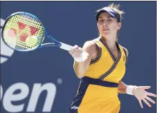  ?? Al Bello / Getty Images ?? Belinda Bencic of Switzerlan­d hits a return to Iga Swiatek of Poland during their fourth round match at the U.S. Open on Monday in New York.