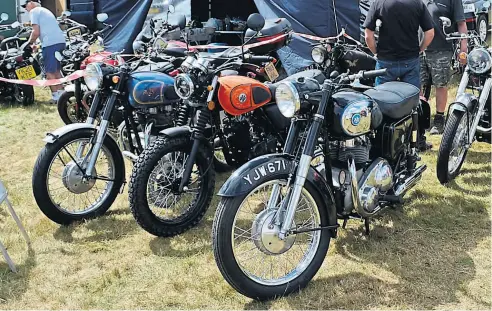  ?? ?? The AJS and Matchless OC stand – two traditiona­l late 1950s/early 60s Ajay twins flank a modern Nick Brown 125cc AJS.