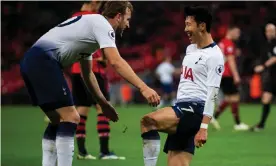  ??  ?? Son Heung-min celebrates scoring Tottenham’s third with Harry Kane. Photograph: James Fearn/PPAUK