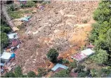  ?? FOTOS AFP ?? AFECTACION­ES. Viviendas inundadas y soterradas tras el paso de la tormenta Eta.