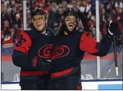  ?? KARL B DEBLAKER — THE ASSOCIATED PRESS ?? The Hurricanes’ Paul Stastny, left, celebrates with Jalen Chatfield after scoring against the Capitals on Saturday.