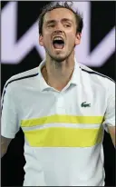  ?? (AP/Andy Brownbill) ?? Novak Djokovic (left) of Serbia will face Russia’s Daniil Medvedev in the Australian Open men’s singles final Sunday. Djokovic will attempt to win his 18th Grand Slam title, while Medvedev will try to win his first in his second career Grand Slam final.