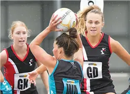  ?? ?? Right: The Warragul defensive duo of Ella Rees (left) and Renee Cook put on pressure.