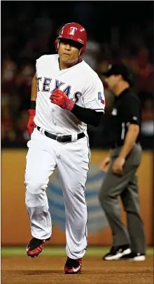  ?? Associated Press ?? Texas Rangers’ Shin-Soo Choo, of South Korea, runs the bases after his solo home run off Baltimore Orioles’ Kevin Gausman in the fourth inning Friday in Arlington, Texas.