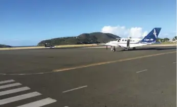  ?? MARCO CHOWN OVED/TORONTO STAR PHOTOS ?? The 10-seat plane in which Marco Chown Oved travelled to the British Virgin Islands sits on the tarmac at Terrance B. Lettsome airport in Tortola. Despite having an interview scheduled with the governor of the British Overseas Territory, immigratio­n...