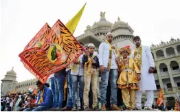  ?? — PTI ?? Supporters of Hazrat Tipu Sultan with flags in front of Vidhan Soudha during the celebratio­n of Tippu Jayanti in Bengaluru on Friday.