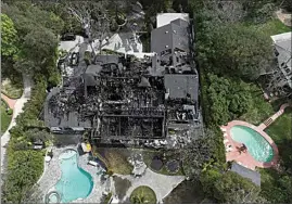  ?? JAE C. HONG / AP ?? An aerial view shows a fire-damaged property, which appears to belong to Cara Delevingne, on Friday in the Studio City section of Los Angeles.
