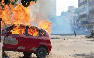  ??  ?? One of the vehicles that were torched by MDC-Alliance supporters near Simon Vengai Muzenda Street bus terminus (formerly Fourth Street) at ZANU-PF Harare Provincial offices yesterday. — (More pictures on Page 4). — (Picture by Tawanda Mudimu)