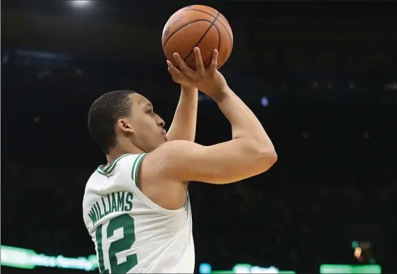  ?? NANCY LANE / HERALD STAFF ?? SHOOTING STAR: Grant Williams puts up a 3-pointer during the second quarter of the Celtics’ 109-81 win in Game 7 of the Eastern Conference semifinals at the TD Garden on Sunday.