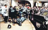  ?? AFP ?? Police and Secret Service agents react during the 1981 attempt to kill then US president Ronald Reagan in Washington, DC.