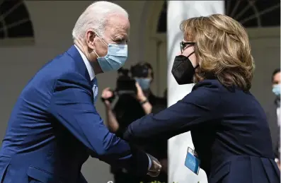  ?? BRENDAN SMIALOWSKI AFP via Getty Images ?? President Joe Biden greets former Representa­tive Gabby Giffords, a gun violence survivor, after he spoke about gun violence prevention at the White House on Thursday. Biden unveiled six measures aimed at curbing gun violence.