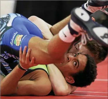  ?? PHOTO PROVIDED ?? Maple Hill’s Trent Svingala took 3rd place with a 3-1 record at the The Journeymen World Freestyle Classic April 2223 at Union College in Schenectad­y. Svingala is pictured pinning Kurt Mchenry with a cradle.