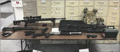  ?? LOS ANGELES POLICE DEPARTMENT VIA AP ?? THIS PHOTO PROVIDED BY THE LOS ANGELES
POLICE DEPARTMENT shows guns and ammunition that were found in an L.A. apartment.