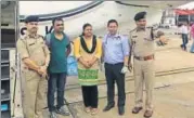  ?? HT PHOTO ?? Parents of the critically ill boy with Guwahati’s top cops before boarding an air ambulance to New Delhi.