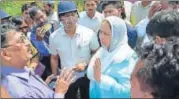  ?? HT ?? ▪ Administra­tive officials talking to locals after the attack.