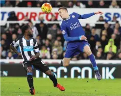  ??  ?? NEWCASTLE: Newcastle United’s Dutch midfielder Vurnon Anita (left) vies with Leicester City’s English striker Jamie Vardy during the English Premier League football match between Newcastle United and Leicester City at St James’ Park yesterday. — AFP