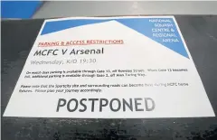  ?? AFP ?? A message at the Etihad Stadium saying yesterday’s match is postponed.