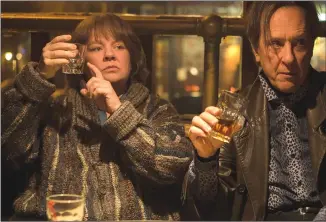  ?? Associated Press photo ?? This image released by Fox Searchligh­t Pictures shows Melissa McCarthy, left, and Richard E. Grant in a scene from “Can You Ever Forgive Me?”