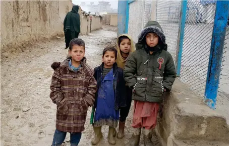  ?? AN photo by Sayed Salahuddin ?? Children outside their homes at the Charahi Qambar camp, which houses thousands of war-displaced Afghans.