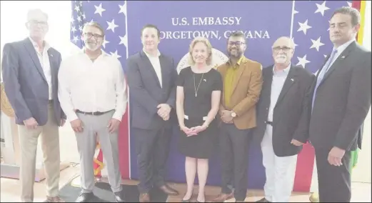  ?? ?? US Ambassador Sarah-Ann Lynch at centre with team members. Third from right is the Mayor of Georgetown Ubraj Singh. (US Embassy photo)