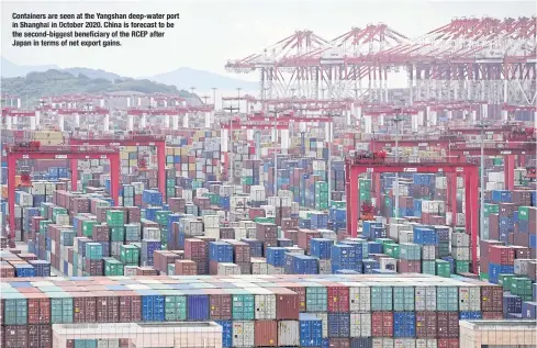  ?? ?? Containers are seen at the Yangshan deep-water port in Shanghai in October 2020. China isforecast to be the second-biggest beneficiar­y of the RCEP after Japan in terms of net export gains.