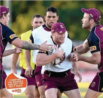  ?? PHOTO: BRADLEY KANARIS/GETTY ?? DEFENSIVE PLAY: Tim Glasby takes on the defence during a Queensland State of Origin training session.