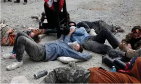  ?? Photograph: Jen Osborne ?? Protesters on the floor of the logging road. One protester said: ‘The [police] are getting very frustrated by our tenacity because we’re constantly rebuilding and coming up with new ideas.’