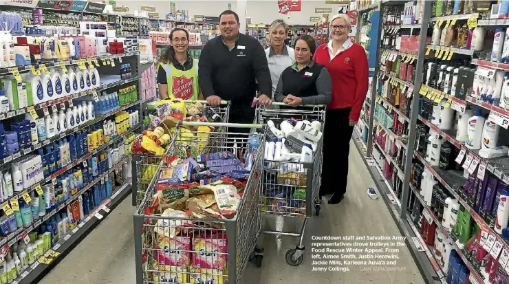  ??  ?? Countdown staff and Salvation Army representa­tives drove trolleys in the Food Rescue Winter Appeal. From left, Aimee Smith, Justin Herewini, Jackie Mills, Karleena Auva’a and Jenny Collings.