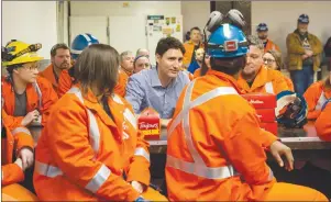  ?? CP PHOTO ?? Prime Minister Justin Trudeau speaks with workers during a visit to Stelco Hamilton Works in Hamilton Ont., Tuesday.