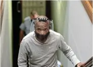 ?? Picture: EUGENE COETZEE ?? MULTIPLE CHARGES: Thembinkos­i Ngcolomba at the Port Elizabeth High Court at the start of the trial