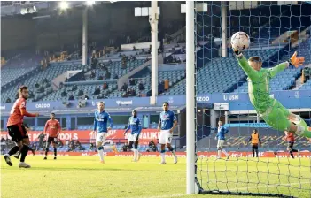  ?? AFP ?? ON TARGET: Bruno Fernandes (second left) scores a goal past Everton’s goalkeeper Jordan Pickford during the English Premier League match. —