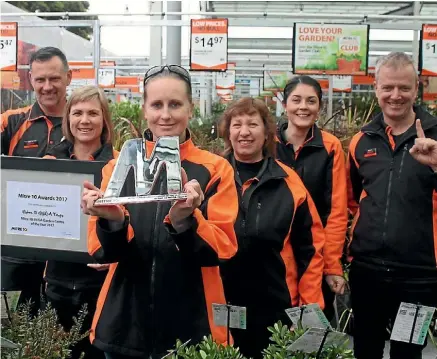  ??  ?? Garden centre supervisor Tina Robertson (front), Mitre 10 Taupo owner Craig Ladbrook (right)