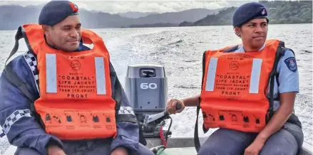  ?? Photo: Fiji Police Force ?? Police officers wearing lifejacket­s in the open sea.